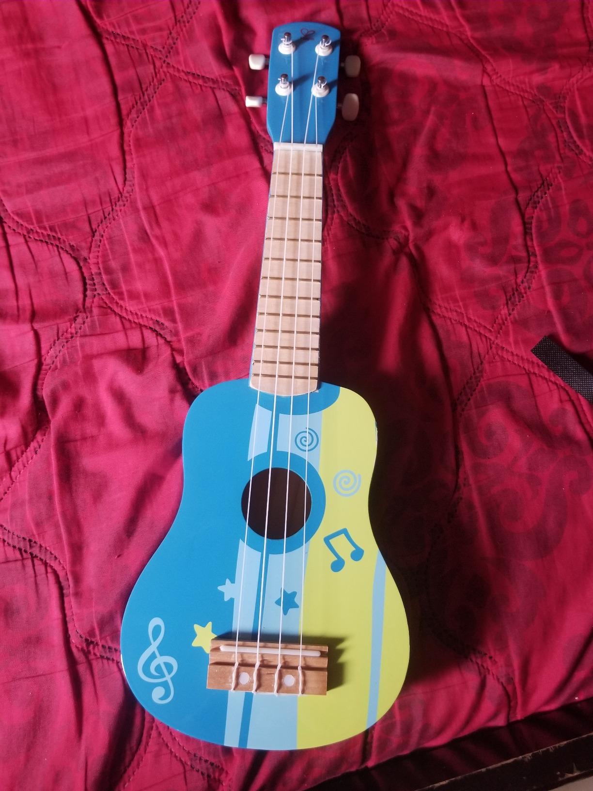 Hape Kid's Wooden Toy Ukulele, Red customer photo 1