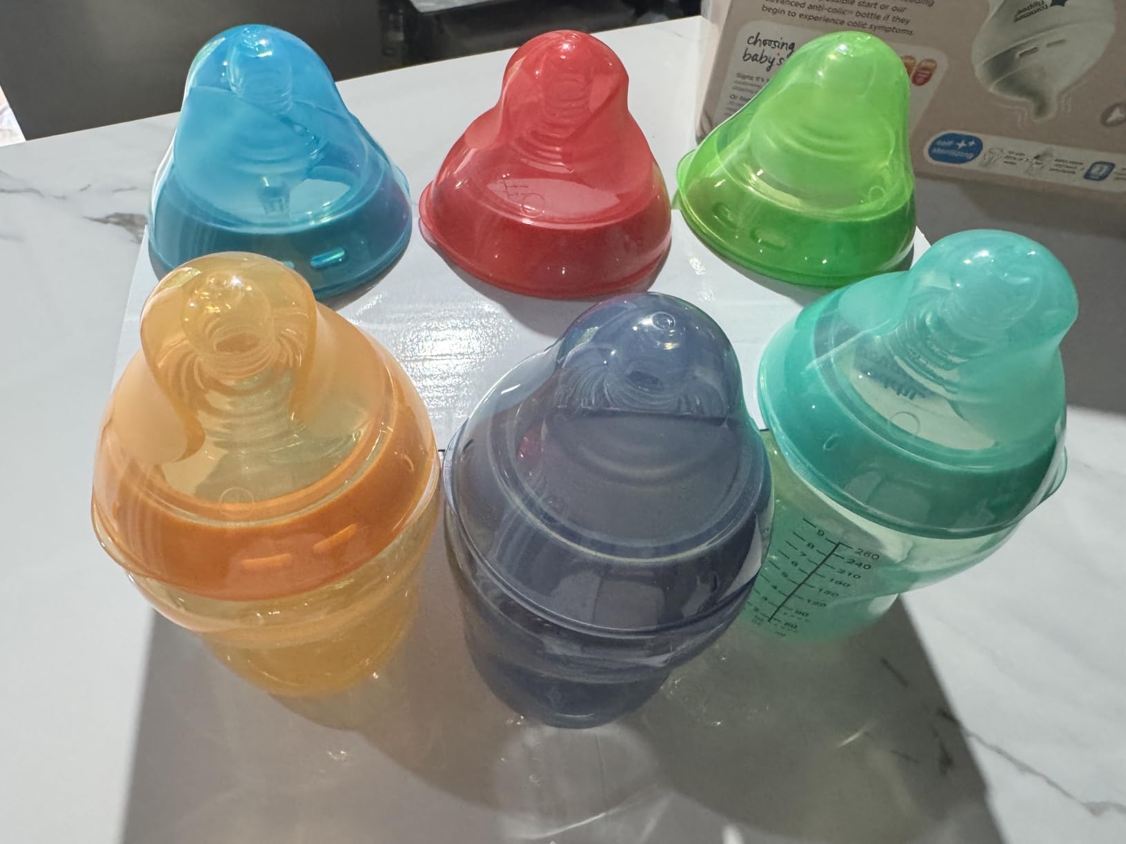 Tommee Tippee Natural Start Baby Bottles, Anti-Colic, 0m+, 9oz | Pack of 6, Slow Flow Breast-Like Nipple, Self-Sterilizing, Seamless Bottle-to-Breast Transition, Fiesta Colors, BPA Free customer photo 2